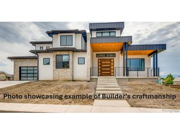 Modern home showcasing a layered facade and stylish garage entrance at 3367 Prospector Dr, Broomfield, CO 80023