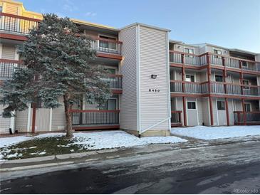 Exterior view of a condo building with snow on the ground at 8450 Decatur St # 102, Westminster, CO 80031