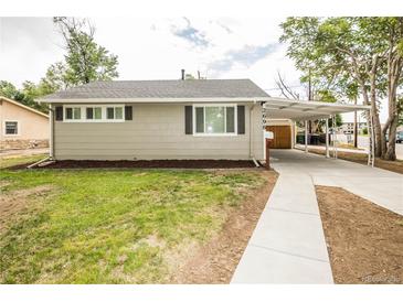 Cozy one-story home featuring a covered carport and newly landscaped front yard at 2696 S Grove St, Denver, CO 80219