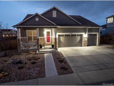 Charming single-Gathering home with a well-manicured yard, inviting entrance, and a convenient three-car garage at 14232 Elm St, Thornton, CO 80602
