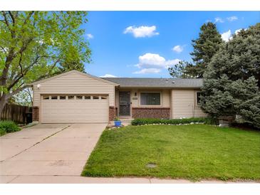 Charming single-story home with a well-manicured lawn and attached two-car garage at 4994 S Independence Way, Littleton, CO 80123