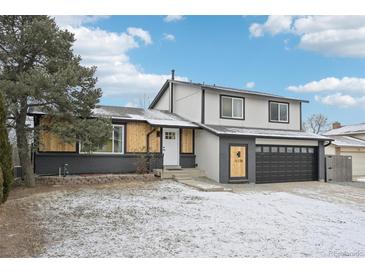 Two story home with a two car garage, front yard, and nice curb appeal at 11278 Clermont Dr, Thornton, CO 80233