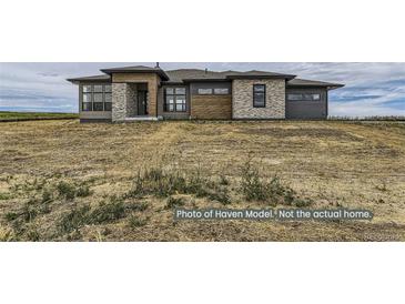 Craftsman style home with stone and wood accents at 9719 Canyon Wind Pt, Parker, CO 80138