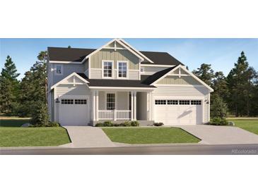 Charming two-story home with a two-car garage and a well-manicured front yard in a suburban neighborhood at 39867 Floyd St, Elizabeth, CO 80107