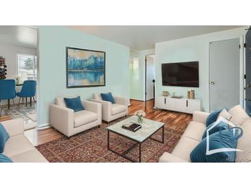 Bright living room with comfortable seating, modern decor, and an open floor plan at 1781 Uinta St, Denver, CO 80220