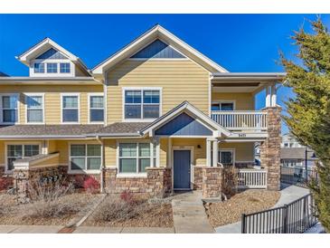 Charming two-story home with a welcoming front porch and well-maintained landscaping at 9471 Ashbury Cir # 202, Parker, CO 80134
