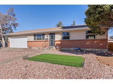 Charming single Gathering home with well maintained front yard and a one car garage at 15303 E 10Th Ave, Aurora, CO 80011