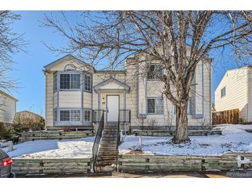 Two-story house with a front yard, steps, and snowy landscaping at 137 S Bedford Ave, Castle Rock, CO 80104