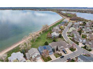 Stunning aerial view of lakeside homes, showcasing their prime location and community setting at 4814 S Upham Ct, Littleton, CO 80123