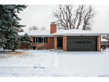 Charming brick home with a well-maintained lawn and attached garage, perfect for suburban living at 768 W Larigo Ave, Littleton, CO 80120