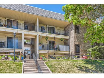 Inviting condo with balcony and outdoor space, enhanced by well-maintained landscaping and a cozy, welcoming facade at 4643 S Lowell Blvd # B, Denver, CO 80236