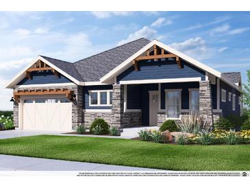 Charming single-Gathering home with a stone and blue siding, a well-manicured lawn, and an attached two-car garage at 14111 Blue Stem St, Broomfield, CO 80020