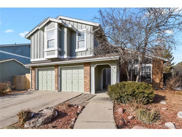 Two-story home with attached two-car garage and brick accents, offering curb appeal at 3283 W 102Nd Pl, Westminster, CO 80031