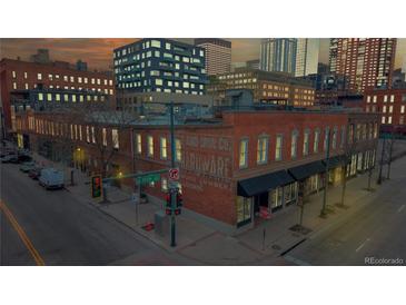 Charming brick building with vintage signage in a bustling urban setting, offering a unique and historic appeal at 1510 Wazee St # 3, Denver, CO 80202