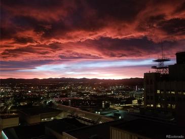 Dramatic view of the city skyline against a colorful sunset sky at 891 14Th St # 2205, Denver, CO 80202