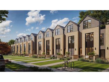 A row of modern brick townhomes with well-maintained lawns and attractive architectural details at 4815 W 10Th Ave, Denver, CO 80204