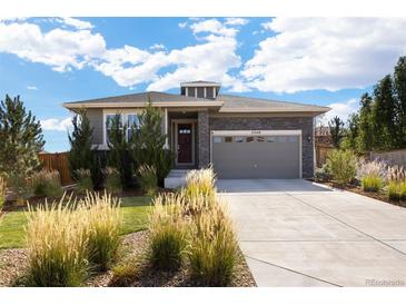 Ranch style home with landscaped yard and two-car garage at 25146 E 1St Ave, Aurora, CO 80018