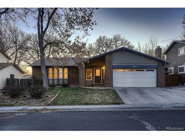 Charming brick home with attached garage, mature trees and landscaping at 8965 Jellison Ct, Broomfield, CO 80021