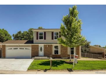 Charming two-story home with well-manicured lawn and inviting front entrance at 4351 E 109Th Ave, Thornton, CO 80233