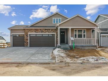 Charming single-Gathering home featuring a three-car garage and covered porch at 39202 Clymer St, Elizabeth, CO 80107