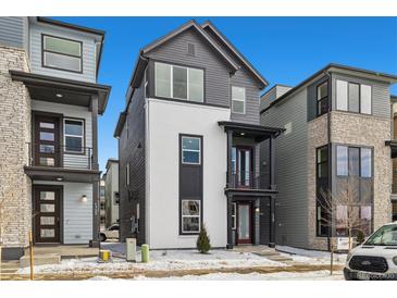 Charming exterior of a two-story home with black and white paint, and a small front yard at 1727 W 166Th Ave, Broomfield, CO 80023