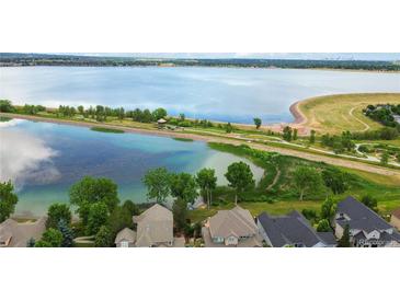 Breathtaking aerial view showcases the community lake and nearby residences at 6296 W Prentice Ave, Littleton, CO 80123