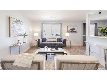 Bright living room featuring contemporary decor, plush seating, and stylish accents creating an inviting atmosphere at 1476 W Dakota Ave, Denver, CO 80223