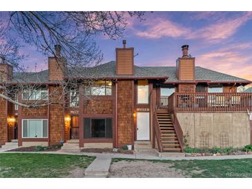 Beautiful townhouse exterior with wood siding and an inviting entryway at 1272 S Crystal Way, Aurora, CO 80012