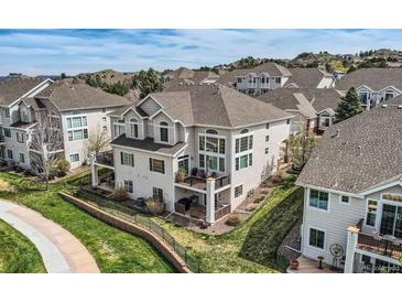 Stunning three-story home boasts a private patio and large windows offering beautiful views at 3109 Newport Cir, Castle Rock, CO 80104