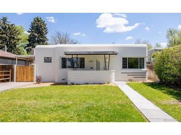 Unique home with flat roof, stucco siding, minimalist landscaping, and art deco design elements at 1010 N Jasmine St, Denver, CO 80220