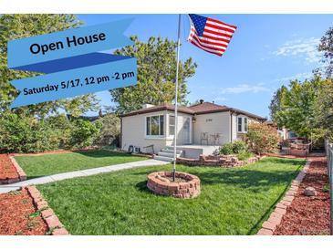 Charming single-story home with a well-maintained lawn, garden bed, and welcoming entrance at 3790 W 54Th Ave, Denver, CO 80221