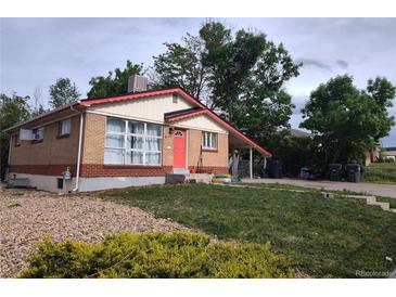 Charming single-story home with a well-maintained front yard and a bright red front door at 10472 Lincoln Ct, Northglenn, CO 80233