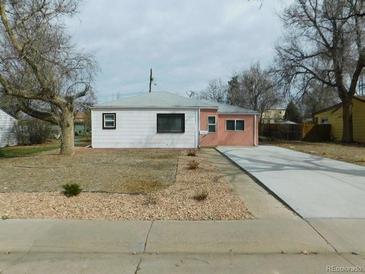 Ranch-style home with a large yard and driveway at 1266 Del Mar Pkwy, Aurora, CO 80010