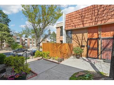 Charming townhome with a private fenced yard and well-maintained landscaping at 6462 E Bates Ave, Denver, CO 80222