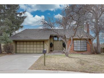 Charming single-Gathering home featuring a two-car garage and lush landscaping, perfect for suburban living at 7690 S Uinta Ct, Centennial, CO 80112
