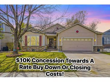 Charming single-Gathering home with a manicured lawn, two-car garage and inviting curb appeal at 2556 E 131St Pl, Thornton, CO 80241