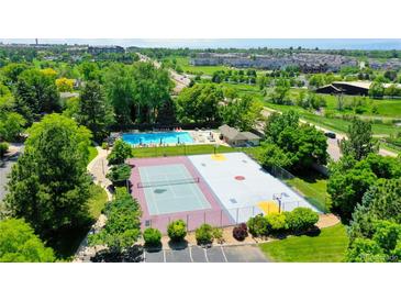 Aerial view showcases the pool, tennis, and basketball courts in a leafy setting at 5050 W 102Nd Ave, Westminster, CO 80031