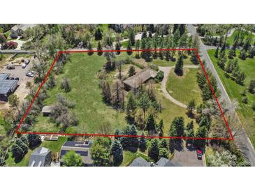 Expansive lot with a home surrounded by lush greenery and mature trees, outlined in red for property lines at 4480 S Franklin St, Cherry Hills Village, CO 80113