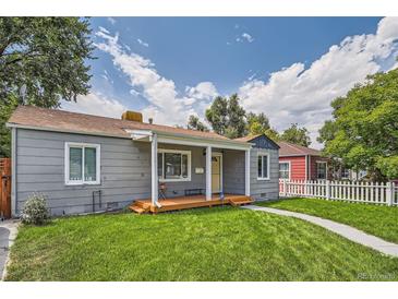 Charming single-story home with a well-maintained lawn and welcoming front porch at 1309 Jamaica St, Aurora, CO 80010