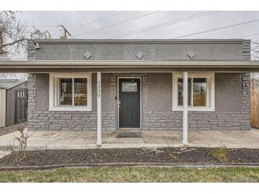 Charming covered front porch with stone accents and white support beams welcomes you home at 3930 W Kentucky Ave, Denver, CO 80219
