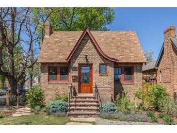 Charming brick home with unique roofline, inviting front steps, and manicured landscaping at 1601 Albion St, Denver, CO 80220