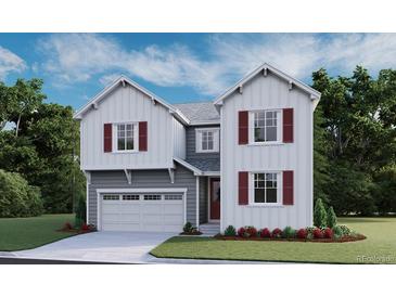 Charming two-story home with a white exterior, red shutters, a well-manicured lawn, and an attached two-car garage at 1401 Lumber Ridge N Cir, Erie, CO 80516