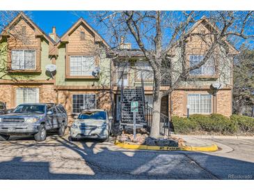 Two-story townhome with parking and landscaping at 61 S Sable Blvd # C14, Aurora, CO 80012