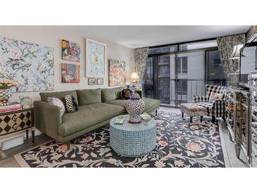 Comfortable living room featuring an L-shaped sofa, patterned rug and eclectic decor at 2 Adams St # 809, Denver, CO 80206