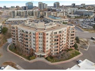 Stunning multi-story condo building with multiple balconies overlooking the cityscape at 4875 S Monaco St # 408, Denver, CO 80237