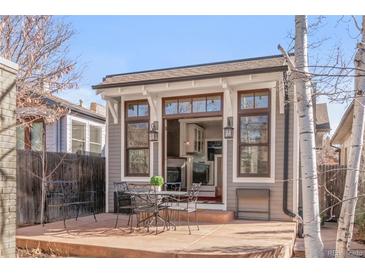 Charming outdoor patio with dining set, perfect for enjoying meals outside with indoor/outdoor access at 543 N Marion St, Denver, CO 80218