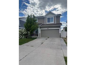 Two-story home featuring neutral siding, stone accents, and an attached two-car garage at 5537 Malta St, Denver, CO 80249