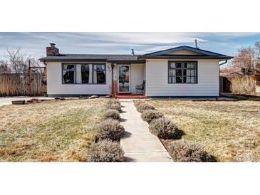 Charming single-story home with a well-maintained front yard and inviting entrance pathway at 835 Lewis Dr, Lakewood, CO 80215