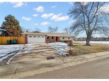 Charming single-story home with a two-car garage and well-maintained front yard at 7746 S Gray St, Littleton, CO 80128