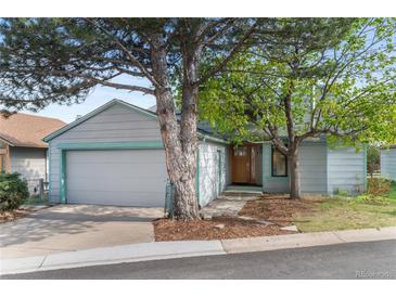 Charming home featuring a two-car garage, mature trees, and lovely landscaping for a welcoming curb appeal at 3620 Silver Plume Ln, Boulder, CO 80305